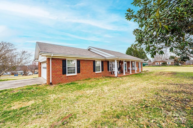 ranch-style house featuring a front lawn, a garage, brick siding, and driveway