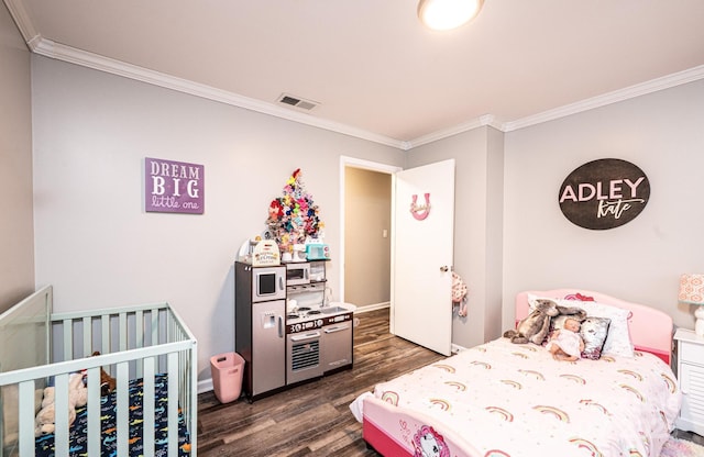 bedroom featuring visible vents, baseboards, ornamental molding, and dark wood-style flooring