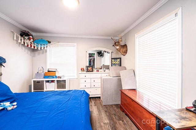 bedroom with dark wood finished floors and ornamental molding