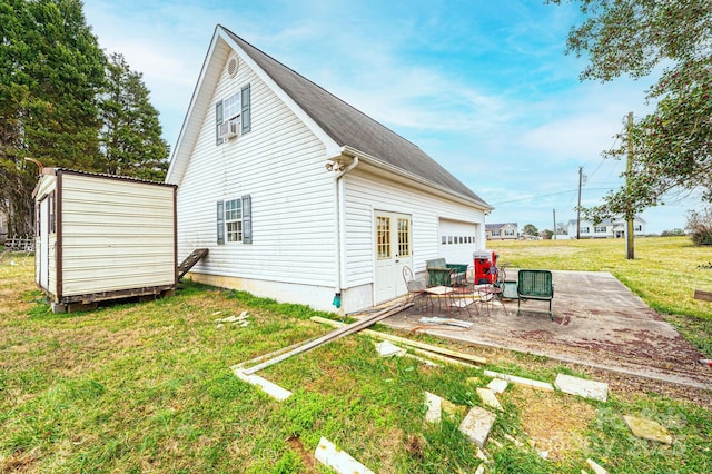 back of property with an outdoor structure and a lawn