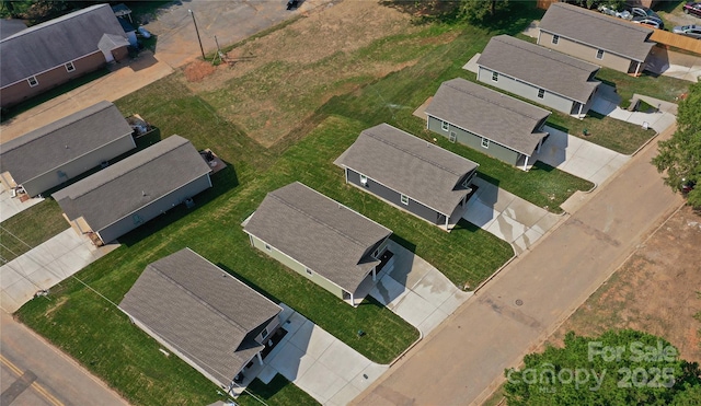 birds eye view of property with a residential view