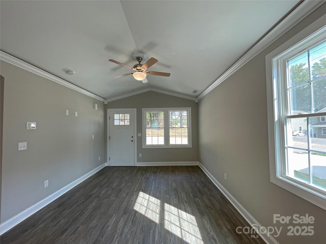 unfurnished living room featuring plenty of natural light, lofted ceiling, and ornamental molding