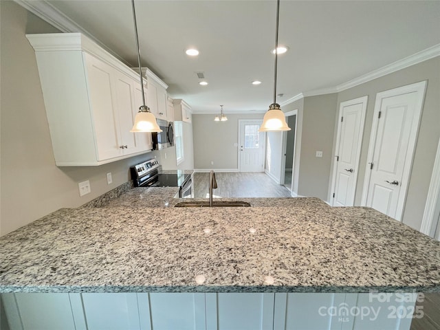 kitchen with light stone counters, white cabinets, stainless steel appliances, and crown molding