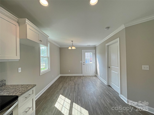 kitchen featuring baseboards, dark wood-style floors, white cabinets, and ornamental molding