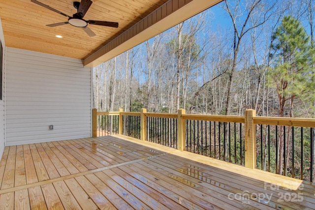 wooden deck with a ceiling fan