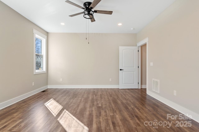 unfurnished room featuring dark wood-style floors, visible vents, recessed lighting, and baseboards