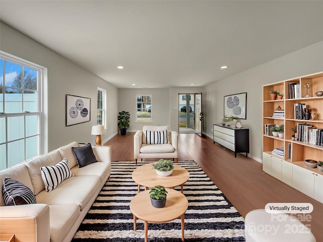 living room with recessed lighting, wood finished floors, and baseboards