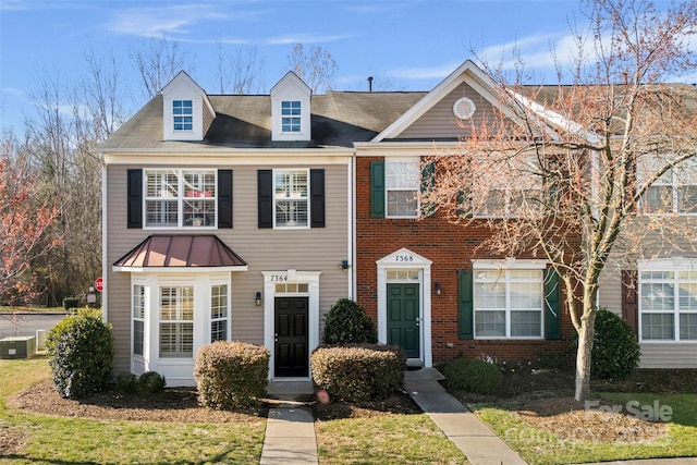 multi unit property with cooling unit and brick siding