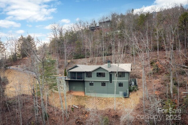 drone / aerial view with a forest view