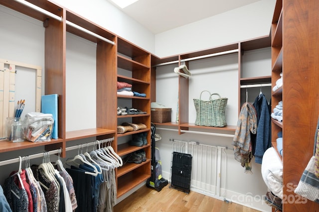 spacious closet with wood finished floors