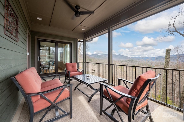 sunroom with a mountain view