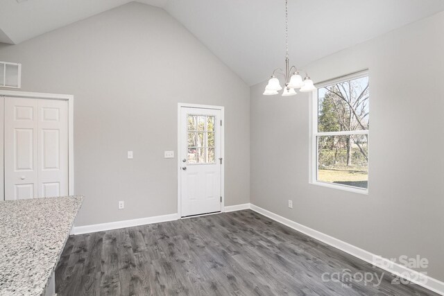 unfurnished dining area with a notable chandelier, plenty of natural light, dark wood-style floors, and visible vents