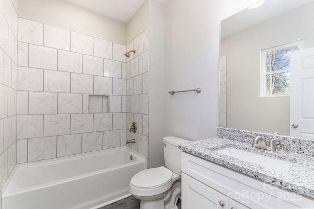 bathroom featuring tub / shower combination, toilet, and vanity
