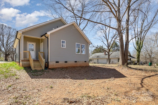 view of side of home featuring crawl space
