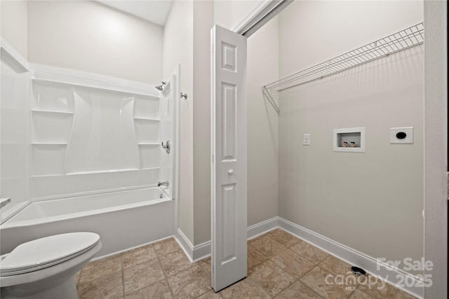 interior space with laundry area, hookup for a washing machine, electric dryer hookup, and baseboards