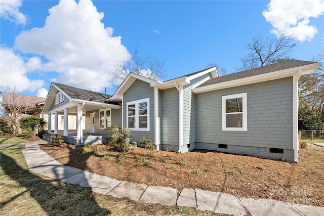 exterior space featuring crawl space and a porch