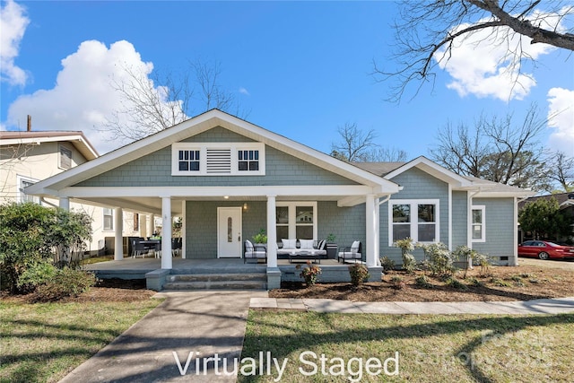 view of front of house featuring a porch and outdoor lounge area