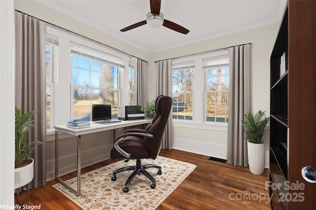 office space with dark wood-type flooring, baseboards, and ornamental molding