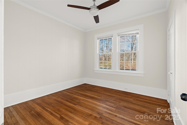 unfurnished room with ceiling fan, baseboards, ornamental molding, and dark wood-style flooring