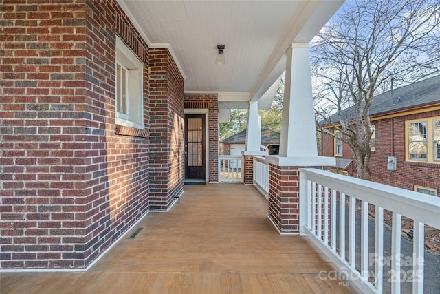 exterior space featuring visible vents and a porch