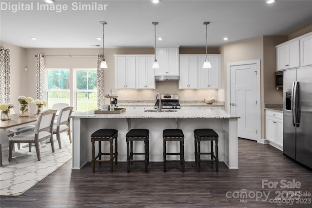 1240 Cottage Green Dr Unit 0132, Monroe, NC 28112 - kitchen with stainless steel appliances, a sink, under cabinet range hood, recessed lighting, and white cabinets