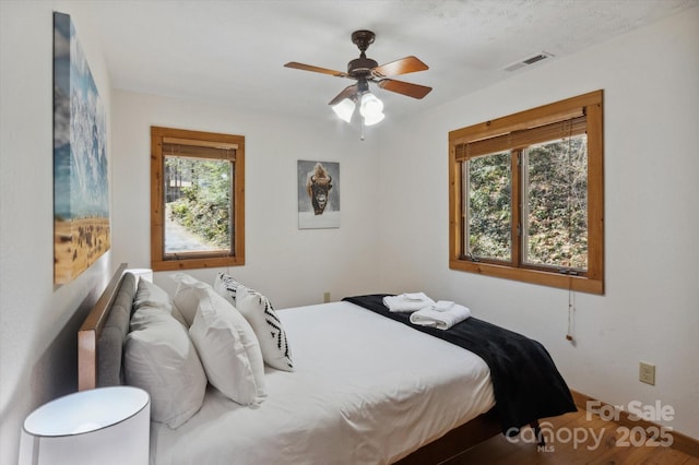 bedroom with visible vents and ceiling fan