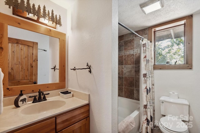 full bath featuring vanity, toilet, shower / bath combo, and a textured ceiling