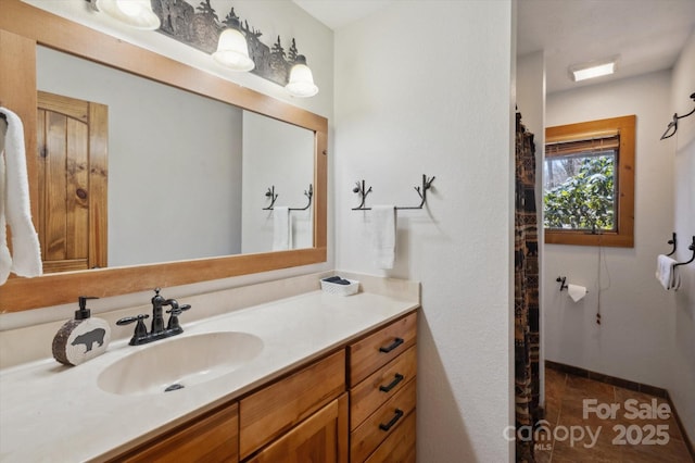 full bath with vanity and tile patterned flooring