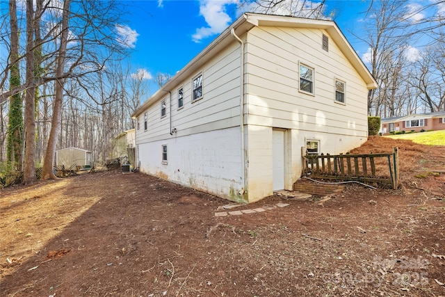 view of side of home with cooling unit