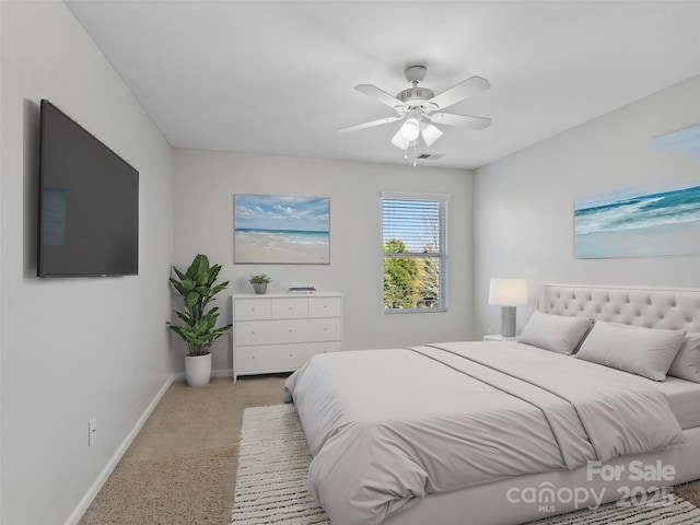 bedroom with visible vents, baseboards, and a ceiling fan