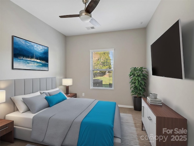 carpeted bedroom with visible vents, baseboards, and ceiling fan