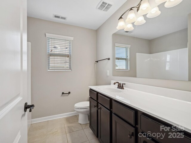 bathroom with visible vents, toilet, and vanity