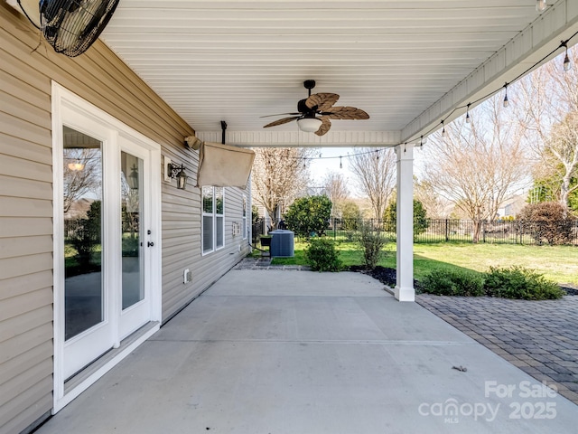 view of patio with central air condition unit, a ceiling fan, and fence