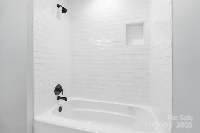 bathroom featuring washtub / shower combination