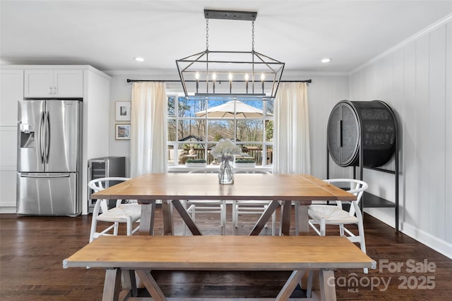 dining area with dark wood-style flooring, recessed lighting, and ornamental molding