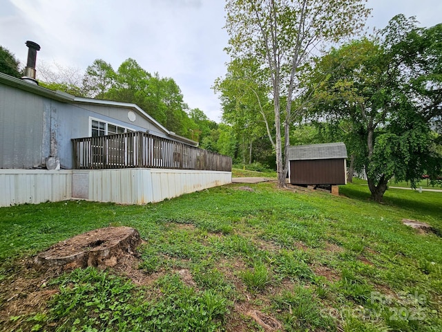 view of yard with an outdoor structure and a shed