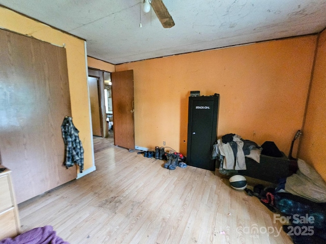 unfurnished bedroom featuring wood finished floors and ceiling fan