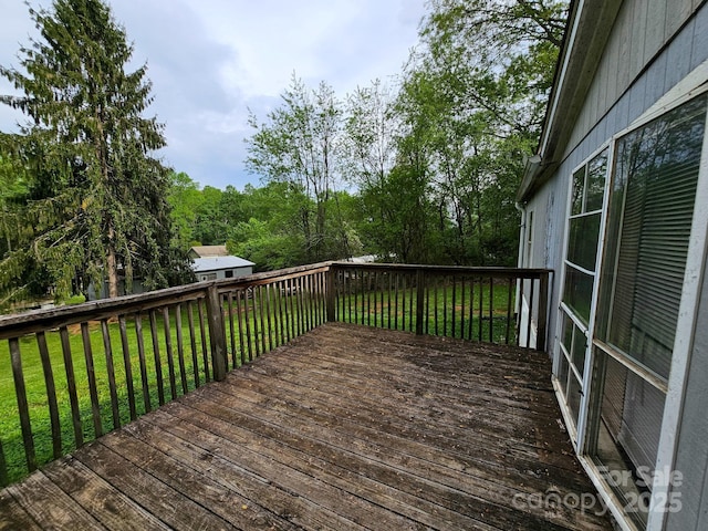 deck featuring a yard