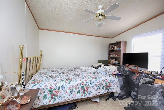 carpeted bedroom with ceiling fan, crown molding, vaulted ceiling, and a textured ceiling