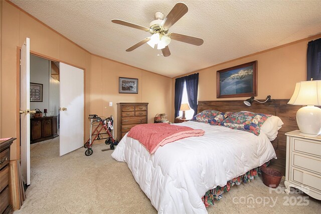 bedroom featuring light colored carpet, a textured ceiling, lofted ceiling, and ornamental molding