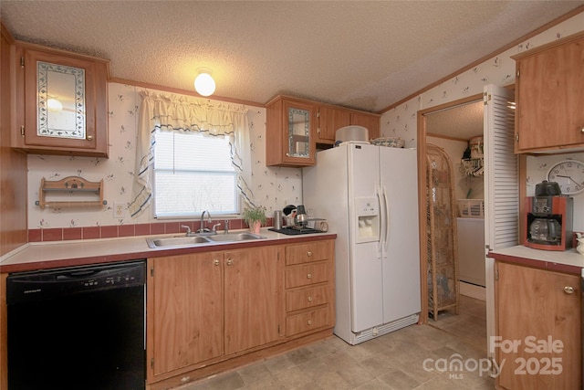 kitchen with wallpapered walls, a sink, black dishwasher, white refrigerator with ice dispenser, and a textured ceiling