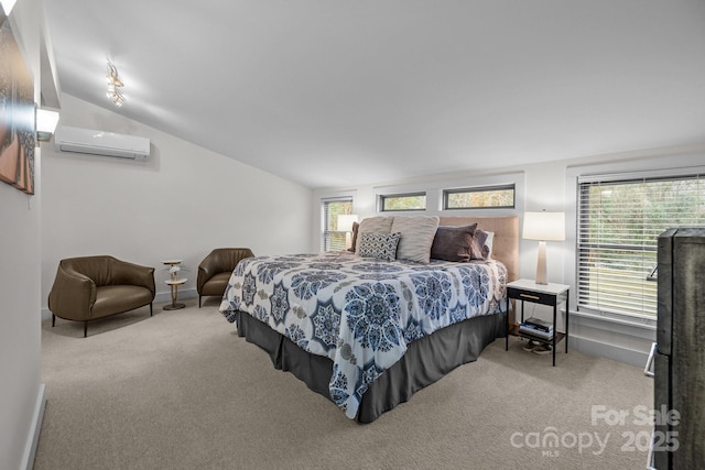 carpeted bedroom featuring a wall mounted AC and lofted ceiling