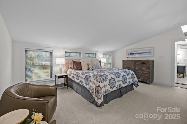 bedroom with vaulted ceiling, carpet, and baseboards