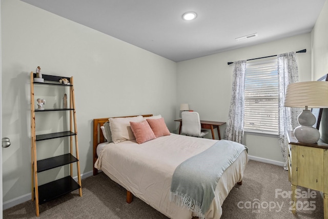 bedroom featuring visible vents, carpet floors, and baseboards