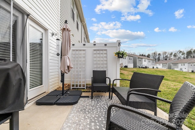 view of patio featuring area for grilling and a residential view