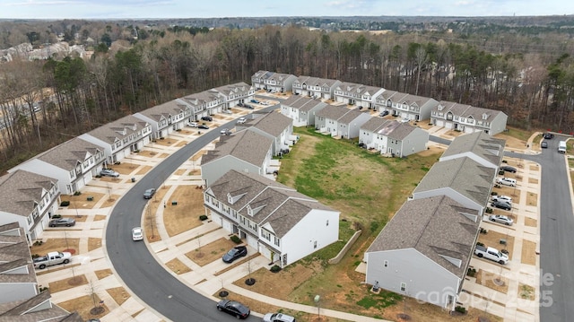 birds eye view of property with a residential view and a forest view