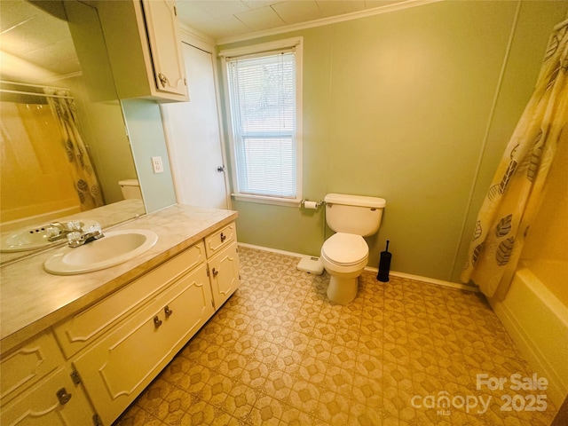 bathroom featuring tile patterned floors, baseboards, toilet, and vanity