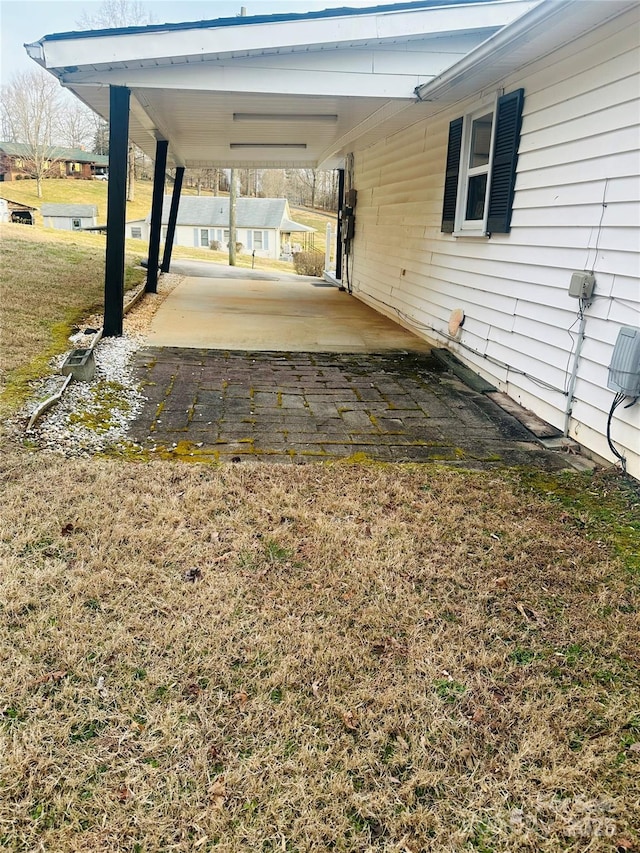 view of patio / terrace with an attached carport