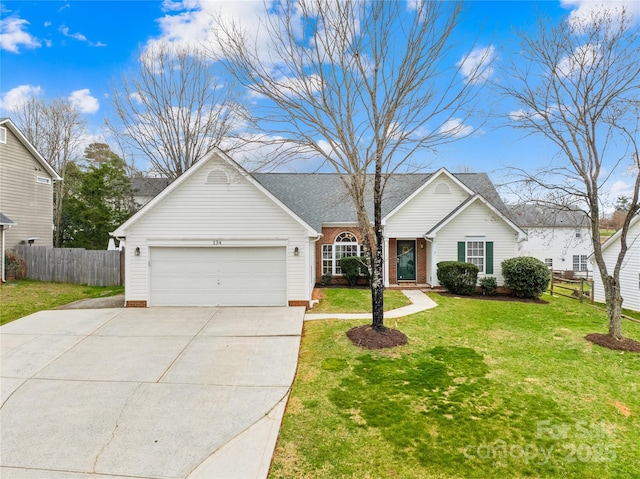 ranch-style house with a garage, driveway, a front yard, and fence