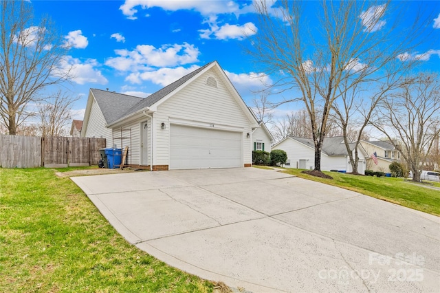 view of property exterior with fence, roof with shingles, an attached garage, concrete driveway, and a lawn